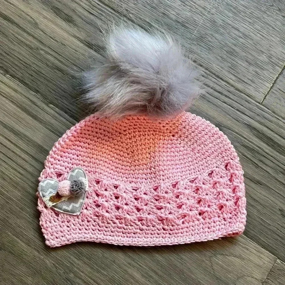 Hand crafted pink crochet girls hat with heart and fuzzy pom pom